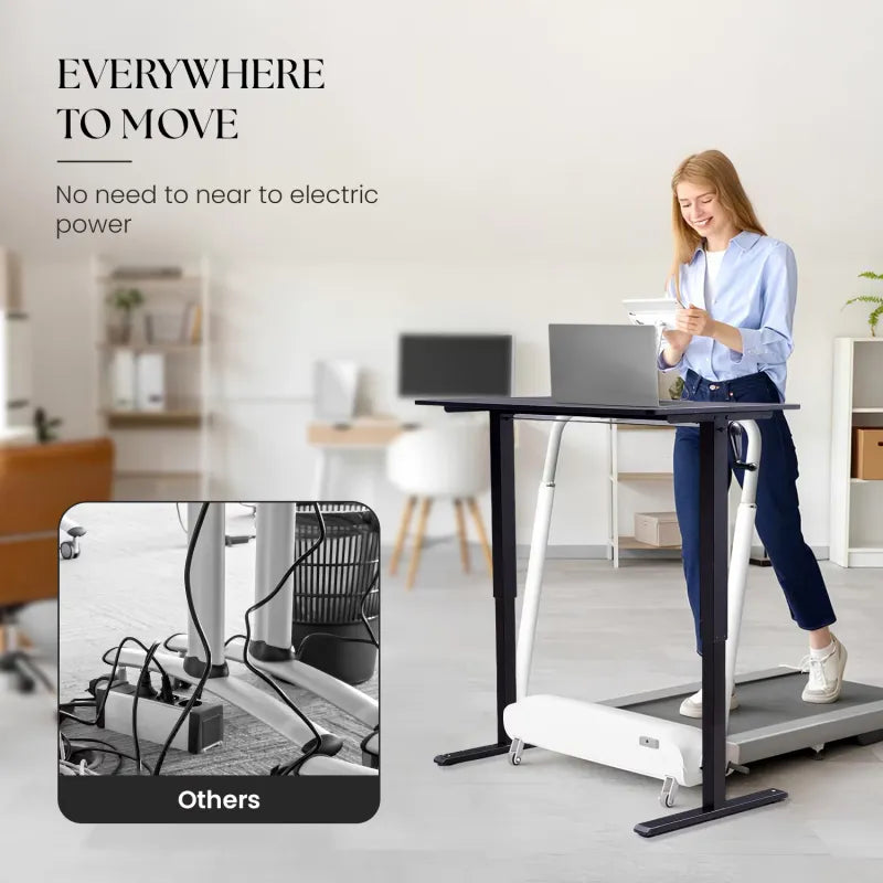 Woman using a hand-crank adjustable desk, showcasing its mobility and flexibility without needing electrical power.