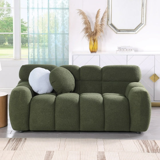 Green Upholstered Sofa Bed with decorative pillows in modern living room setting.