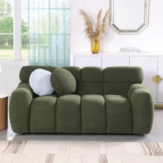 Green Upholstered Sofa Bed with decorative pillows in modern living room setting.